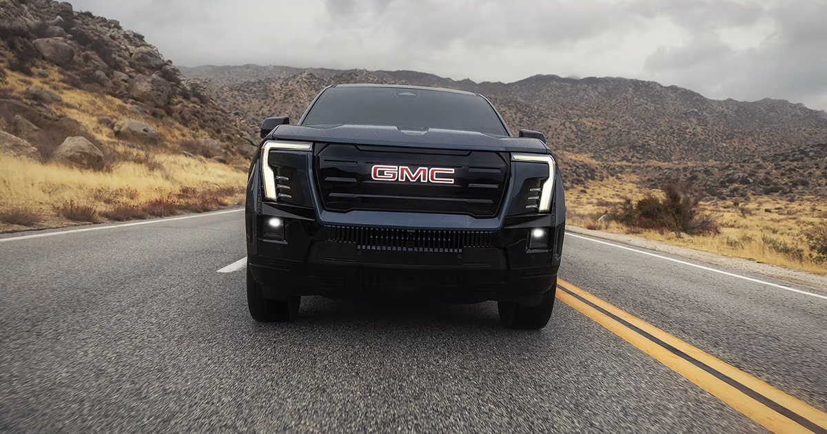 2026 GMC Sierra EV front view showcasing electric pickup truck design and LED lighting